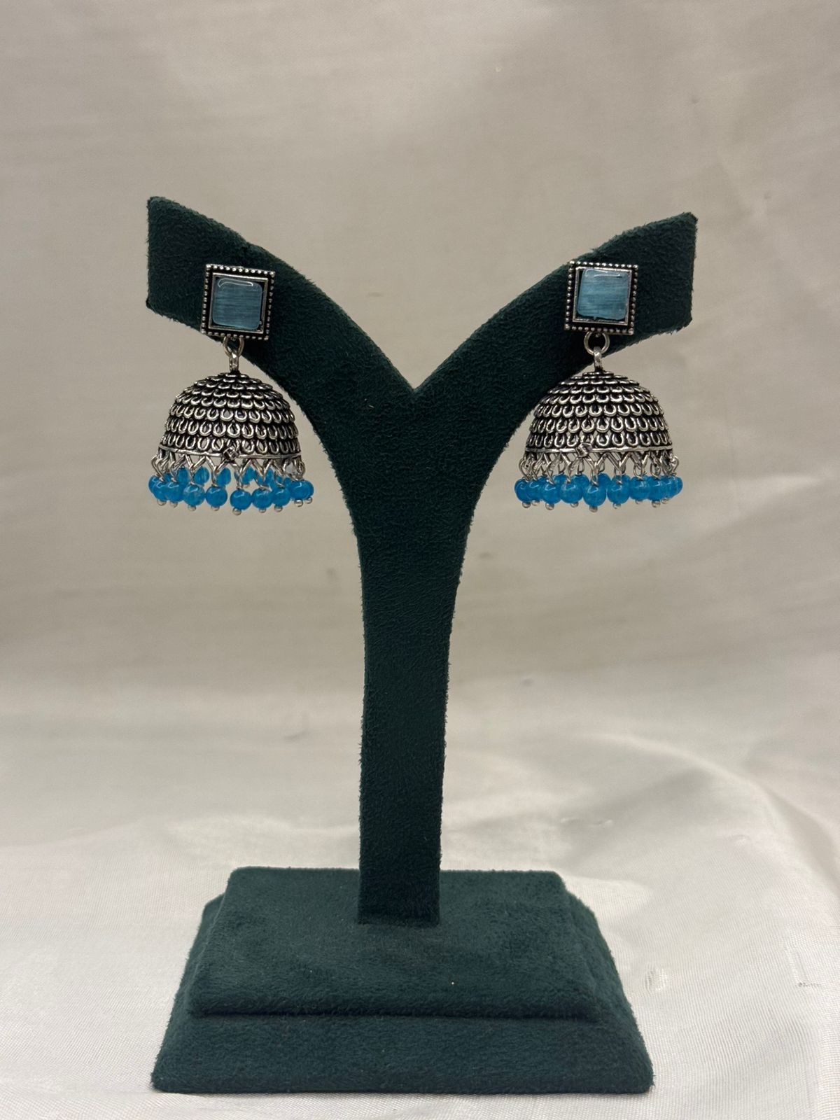 Oxidised Metal Jhumka Earrings with Blue Stone and Beads