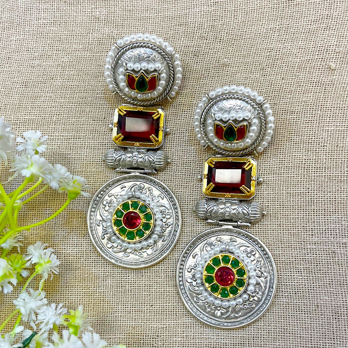 silver earrings with green stone