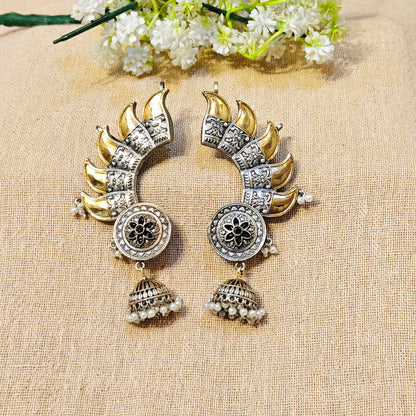 gold and silver earrings with black stones