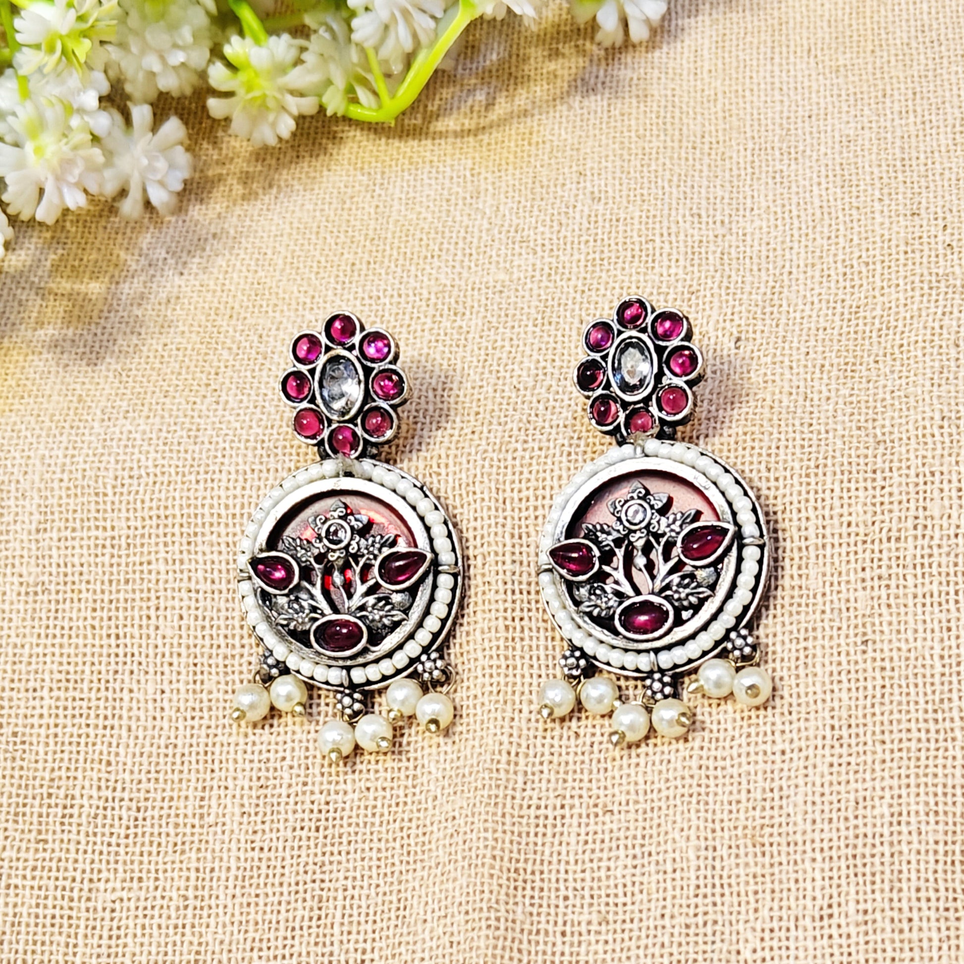 ornate earrings with gemstones