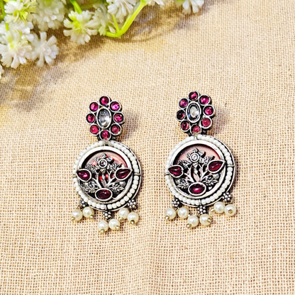 ornate earrings with gemstones